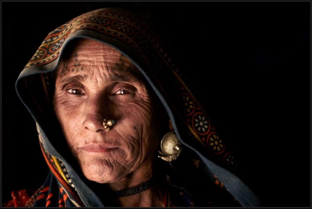 Rabari grandmother with facial tattoos. Facial and neck tattoos are common for all Rabari women - North Gujarat